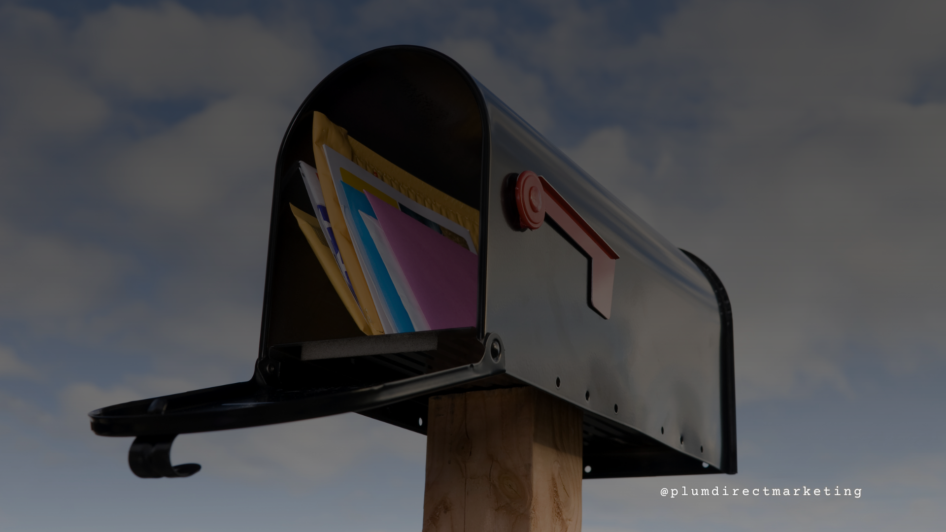 Open mailbox filled with colorful direct mail pieces, symbolizing how poorly targeted or designed mail can get lost in the stack