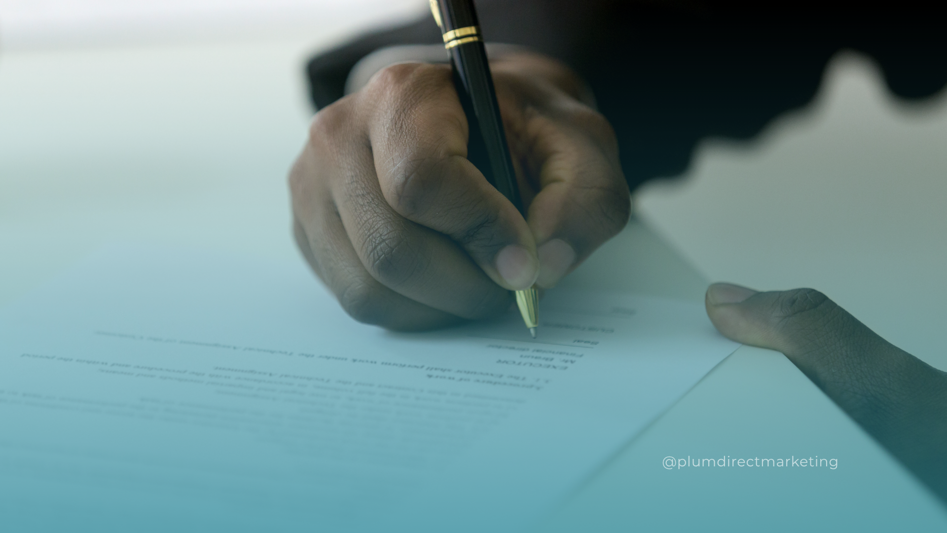 Hand signing a legal document, representing strategic legal marketing decisions in 2024.