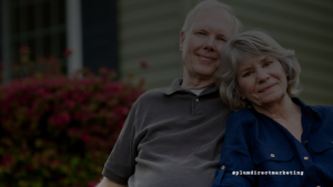 Older couple sitting together outdoors, smiling and relaxed, representing the trust, familiarity, and personal connection Boomers value in direct mail