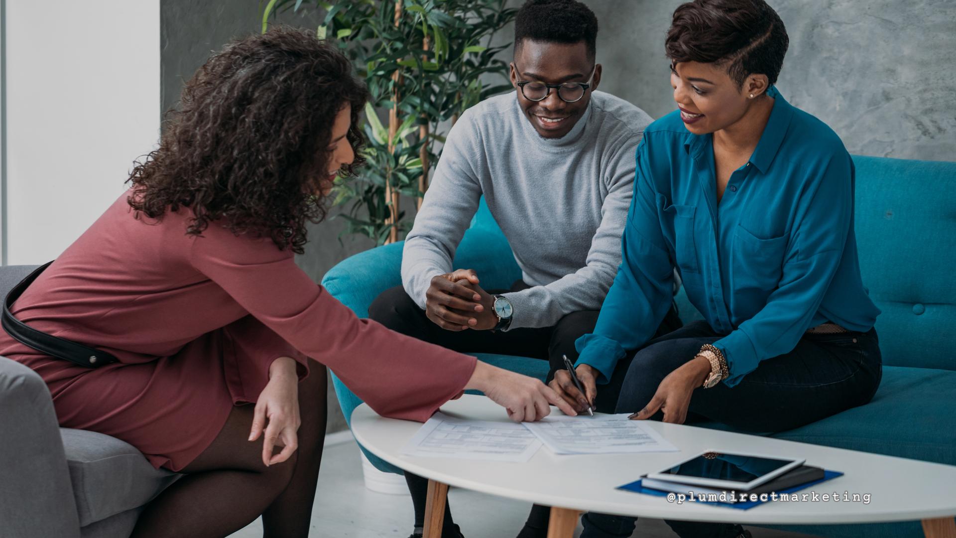 Three professionals discussing follow-up strategies in a business meeting.