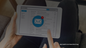 Person checking a crowded inbox on a tablet, symbolizing marketing fatigue from over-personalized email campaigns