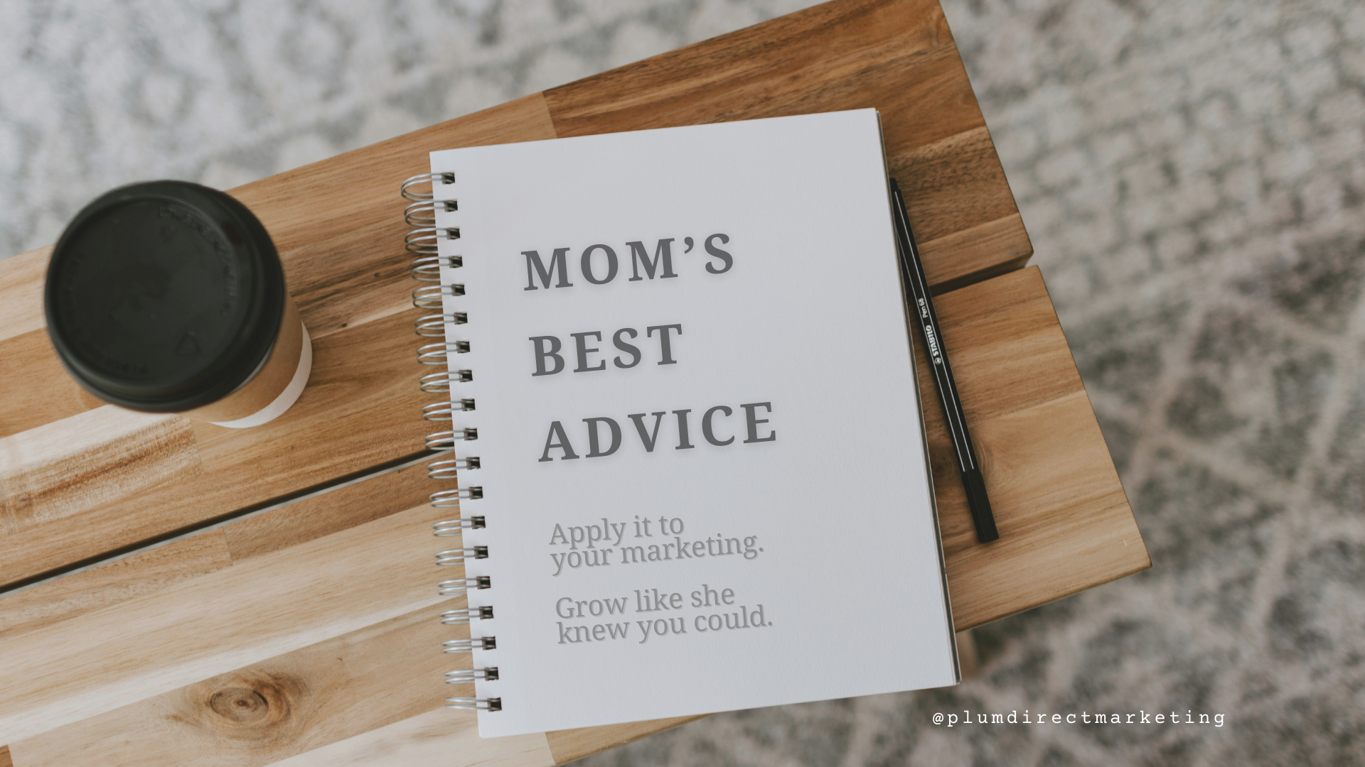 Notebook on desk with the phrase ‘Mom’s Best Advice’—creative concept for financial advisor marketing.