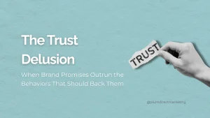 Hand tearing a paper labeled “trust” to illustrate the gap between brand trust promises and real customer behavior.